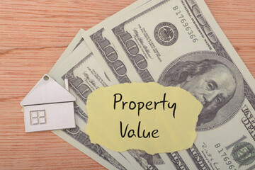 money banknotes, property, and the prominently displayed words PROPERTY VALUE signifies the...