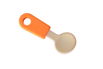 Toy spoon isolated on a white background.The toy spoon, designed for kids, showcases a vibrant rubber handle, offering a safe and playful utensil for children's mealtime adventures.