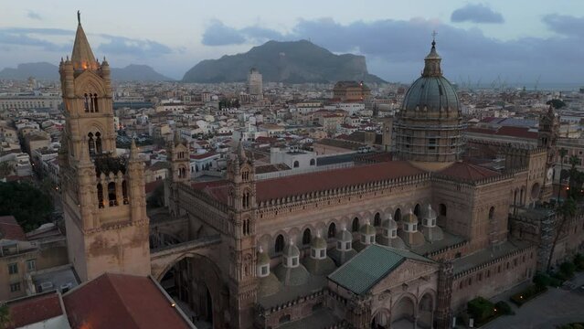 Flying over Palermo Cathedral towards iconic cliff