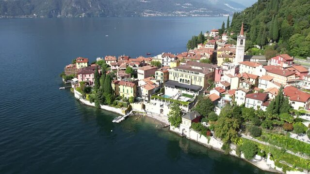 Sunrise flyover above the Italian village of Varenna in Lake Como Italy