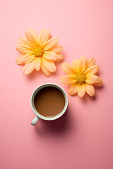 Cup of tea with light orange flowers over a pale pink background