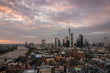 Fototapeta na wymiar The skyline is a modern city with light in the sunset. Beautiful city photo right in the center. Financial center in Frankfurt am Main in Germany