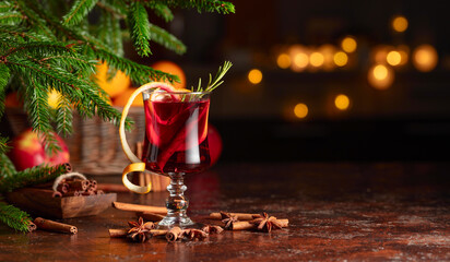 Christmas mulled wine with citrus, cinnamon, anise, and rosemary.