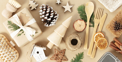 Fototapeta na wymiar Wooden Christmas decorations on beige background, retro style, eco friendly trendy zero waste