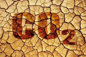 Cracked earth with word CO2. Global warming, climate change concept. Carbon dioxide emission concept