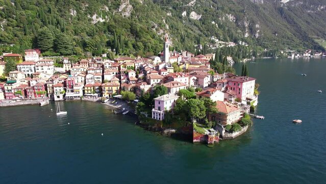 Sunrise flyover above the Italian village of Varenna in Lake Como Italy