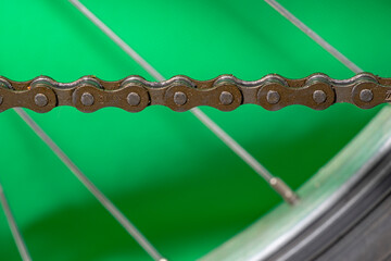 detail of bicycle transmission chain bob green background.
