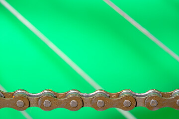 detail of bicycle transmission chain bob green background.