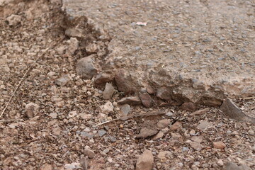 Small Gravel stones falling from damaged or broken ground roads, gravels