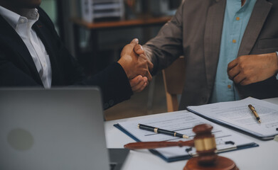 Business and lawyers discussing contract papers with brass scale on desk in office. Law, legal...