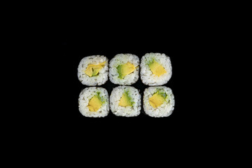 Delicious rolls of Japanese cuisine. Dark background