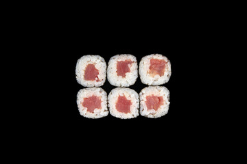 Delicious rolls of Japanese cuisine. Dark background