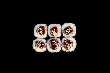 Delicious rolls of Japanese cuisine. Dark background