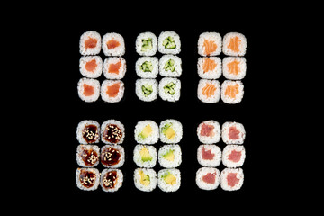 Delicious rolls of Japanese cuisine. Dark background