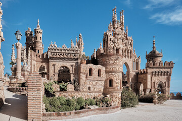 Castillo de Colomares Benalmadena, Malaga, Spain framed by a stone arch with a view to ornate...