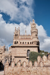 Fototapeta premium Castillo de Colomares Benalmadena, Malaga, Spain framed by a stone arch with a view to ornate turrets and ramparts