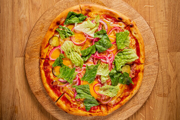 tasty pizza with lettuce and sauce
