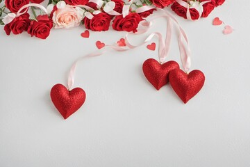 Valentine Day background. Red, pink paper hearts on white background, top view image. Romantic celebration card, flat lay decoration isolated on white. Greeting card concept.