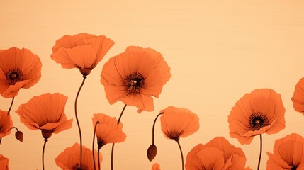  a group of orange flowers in front of a beige background with a black center in the middle of the petals.