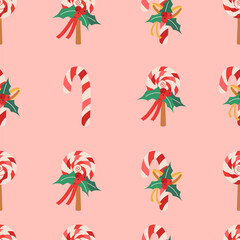 Fototapeta na wymiar Christmas pattern with lollipop with ribbon, berries, and mistletoe leaves.
