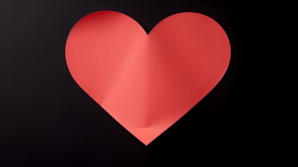 Light Red Paper Heart on a black Background. Romantic Template with Copy Space