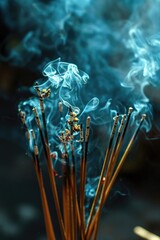 A group of incense sticks emitting smoke. Perfect for creating a peaceful and aromatic atmosphere