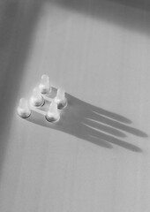 Shot of the chess pieces, pawns, casting shadow in the shape of a crown. ConceptShot of the chess...