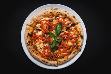 Appetizing pizza with cheese on a dark wooden background. Slice of pizza with stretchy cheese