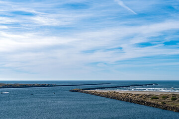 The Yaquina Bay jetty extends into the Pacific Ocean at Newport, Oregon, USA