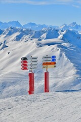 Ski slope sign showing the directions for skiers in Courchevel ski resort 