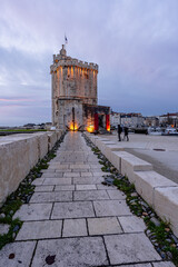 empty street at evening in La rochelle, France. Saint Nicolas Tower in the background