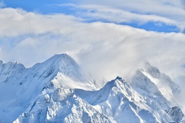 Fototapeta na wymiar Snowcapped mountain by winter in French alps. 