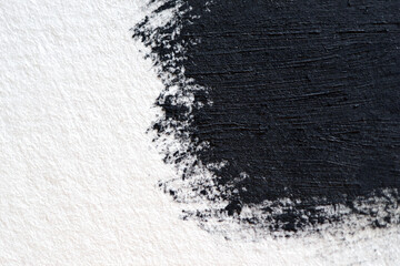 Abstract brush strokes of black paint on white surface. Oval circle with brush black oil paint...