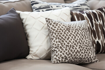 A symmetrical arrangement of pillows and cushions on a well-made bed, showcasing the blend of style and order in the bedroo