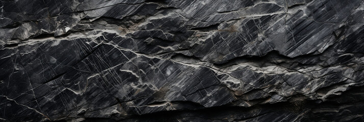 Naklejka premium Panoramic dark stone black-white granite texture. Close-up rock banner ad design. Grunge abstract background with copy space