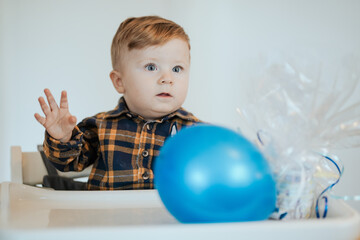 Toddler celebrating birthday playing with Balloon