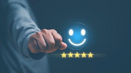 Customer satisfaction experience. Hand holding magnifying glass focus on excellent smiley face with...