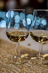 Small tasting glasses of sparkling wine champagne on winter festival in December, Avenue de Champagne, Epernay, Champagne region, France