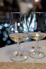 Small tasting glasses of sparkling wine champagne on winter festival in December, Avenue de Champagne, Epernay, Champagne region, France