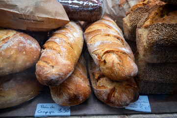 Sour dough bio bread made with natural yeast starter and baked in wood stove on market in France