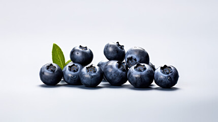 Plump blueberries on a clean white backdrop.