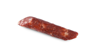 Piece of thin dry smoked sausage isolated on white, top view