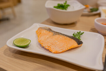 salmon steak on white dish, japanese food and asian food culture