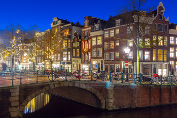 Night Amsterdam canal Spiegelgracht with typical dutch houses, Holland, Netherlands.