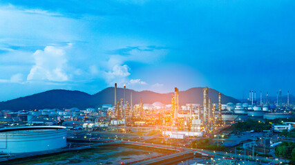 Oil refinery. Aerial view of oil and gas industry refinery. Petrochemical plant area and oil storage tank energy concept during the evening energy concept	
