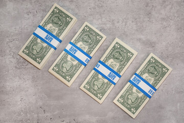 Four straps of one dollar bills. Bank note bundles.