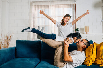 A heartwarming family moment in the living room as an airplane game brings laughter and smiles. The...