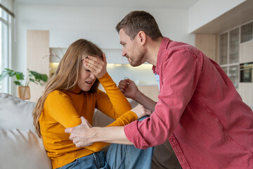 Despotic, rude, jealous husband angry with wife, shocked by betrayal, ready to hit. Woman under...