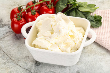 Soft cream cheese in the bowl