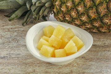 Marinated pineapple slices in the bowl